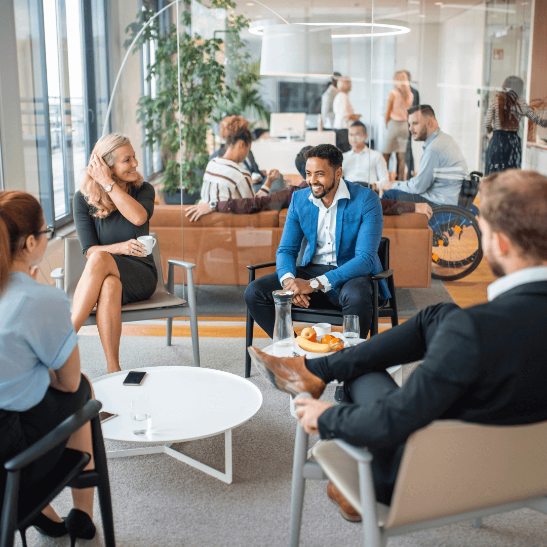 Group of colleagues sitting around the office